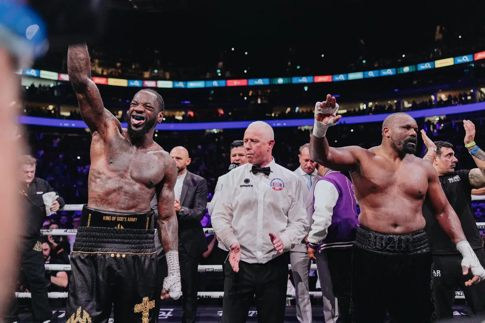 Mark Bates applauds Deontay Wilder and Derek Chisora after their 12-round clash