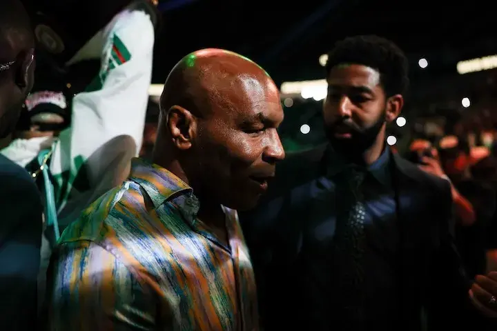 Mike Tyson walks David Benavidez to the ring for his fight against Gilberto Ramirez on Saturday at T-Mobile Arena in Las Vegas. (May 2, 2026)
