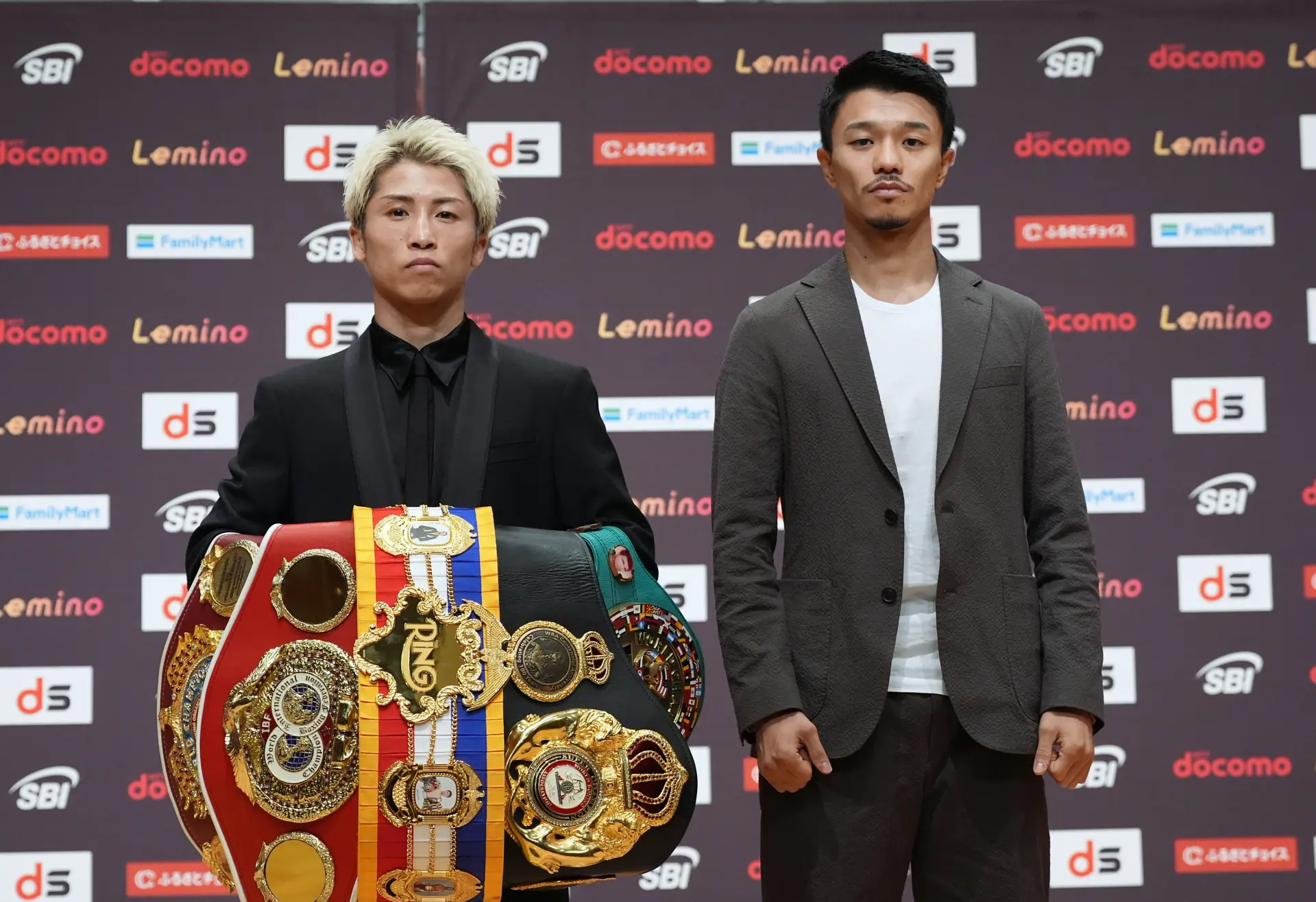 Naoya Inoue, with belt collection, stands alongside Junto Nakatani on April 30