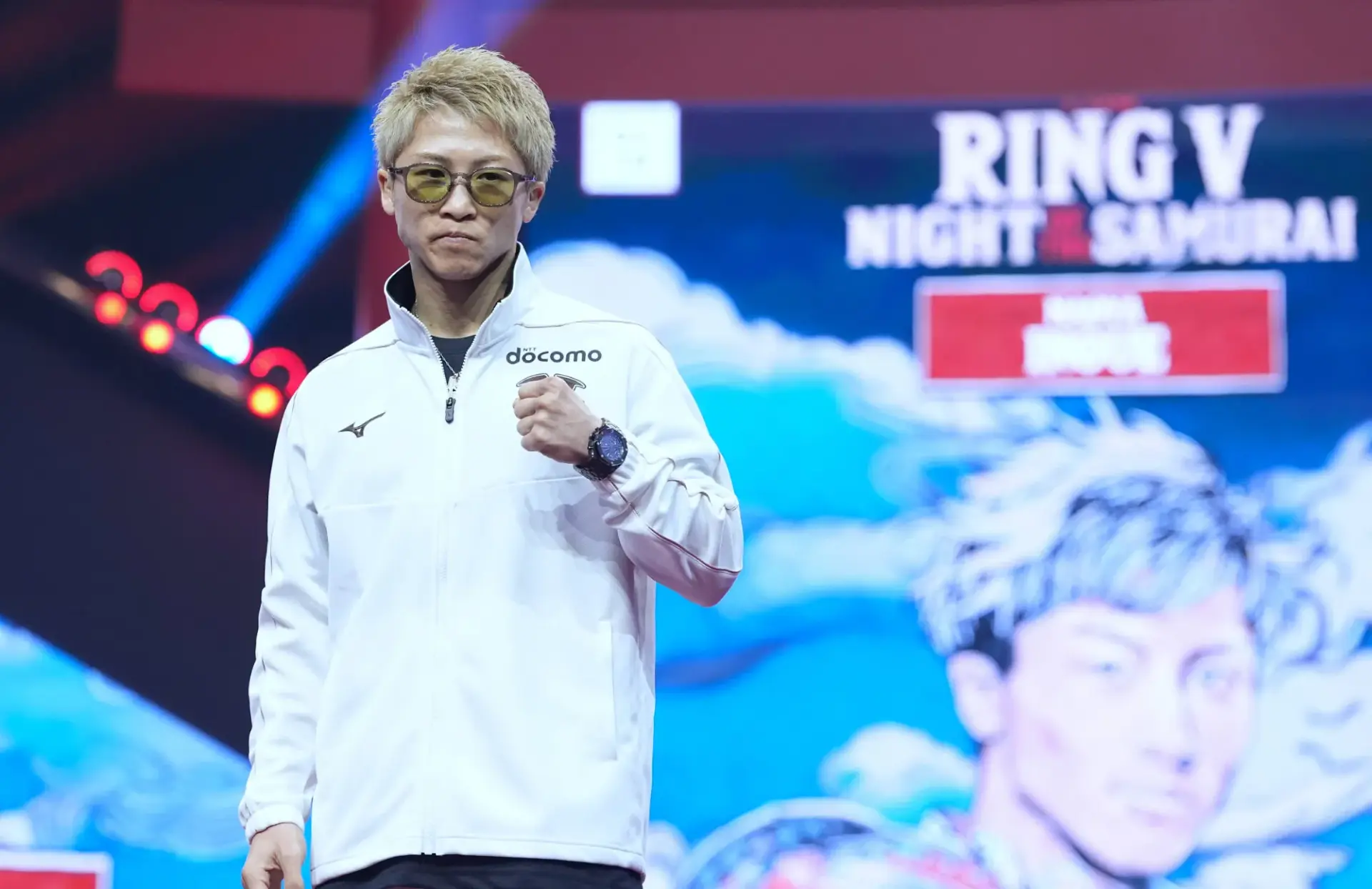 Naoya Inoue holds his left fist in front of him at the grand arrivals for his December 2025 boxing match with Alan David Picasso.