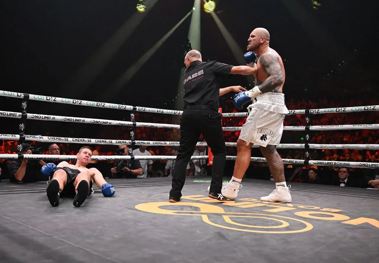 Nelson Asofa Solomona looks down at a dropped Jeremy Latimore during their fight on January 16, 2026.