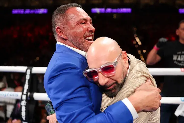 Promoter Oscar De La Hoya and manager Rick Mirigian celebrate