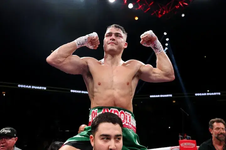 Oscar Duarte is held up on the shoulders of a team member in celebration of his victory over Kenneth Sims Jnr on August 2, 2025.