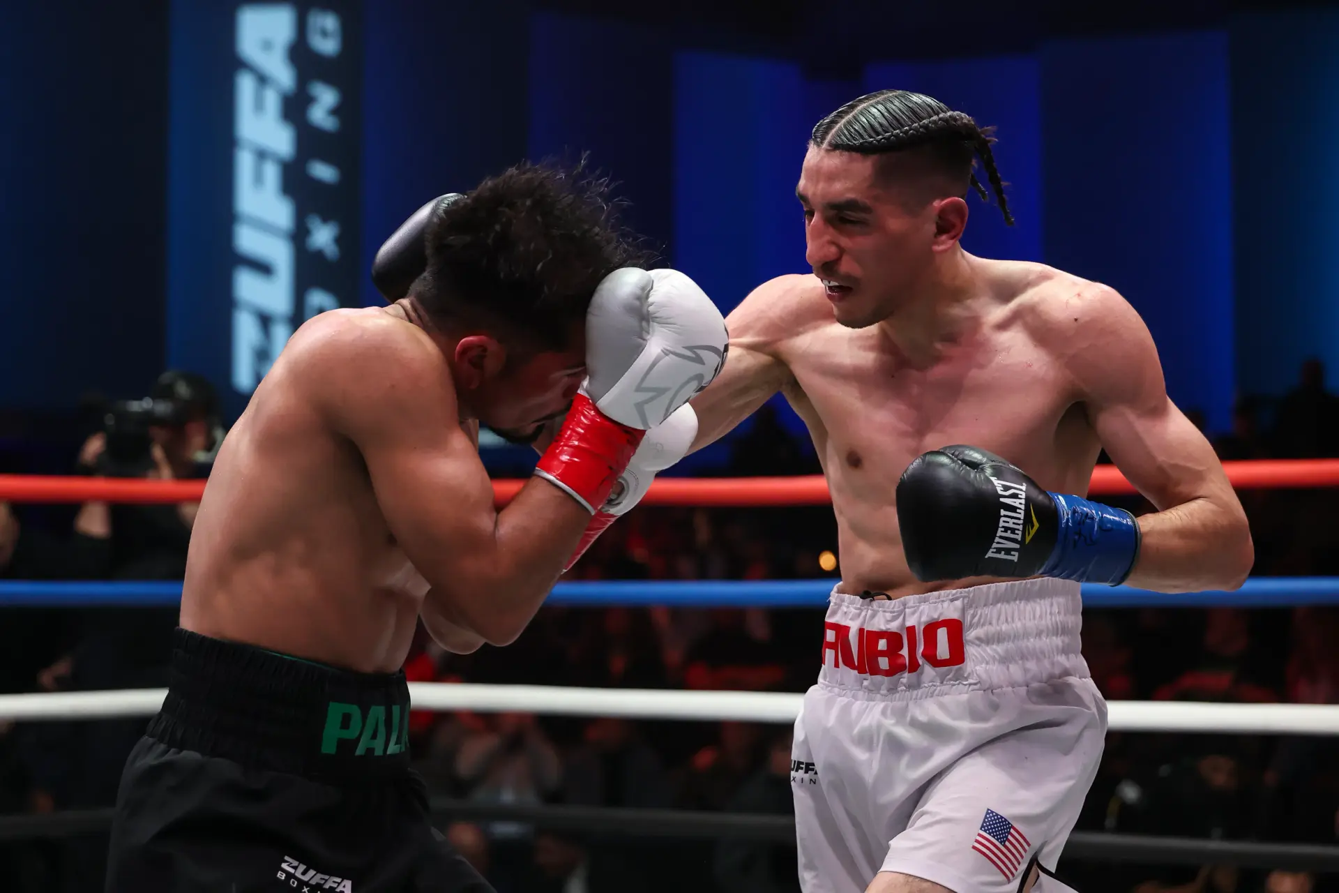 Pablo Rubio lands a right hand on Adan Palma