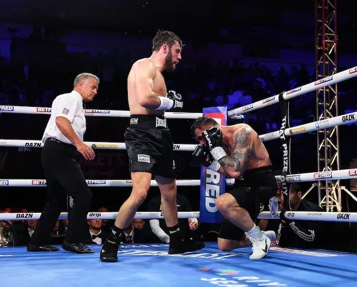 Pat Brown (left) stands over Vasil Ducar who sits on the ropes. (April 3, 2026)