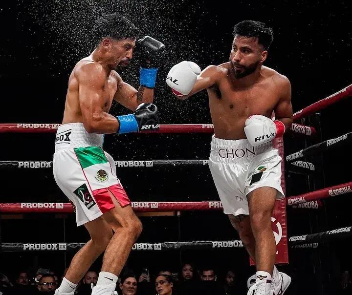 Ramon Cardenas throws a right hand at Erik Robles Ayala in their boxing match on December 18, 2025.