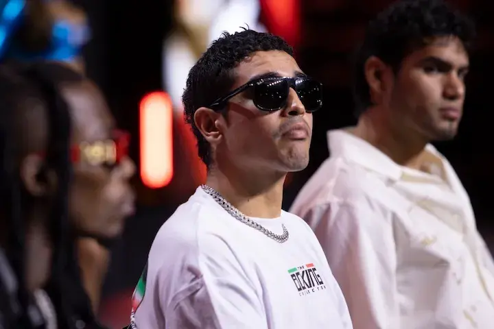 Raul Curiel is seated wearing sunglasses during a press conference on June 26, 2025.