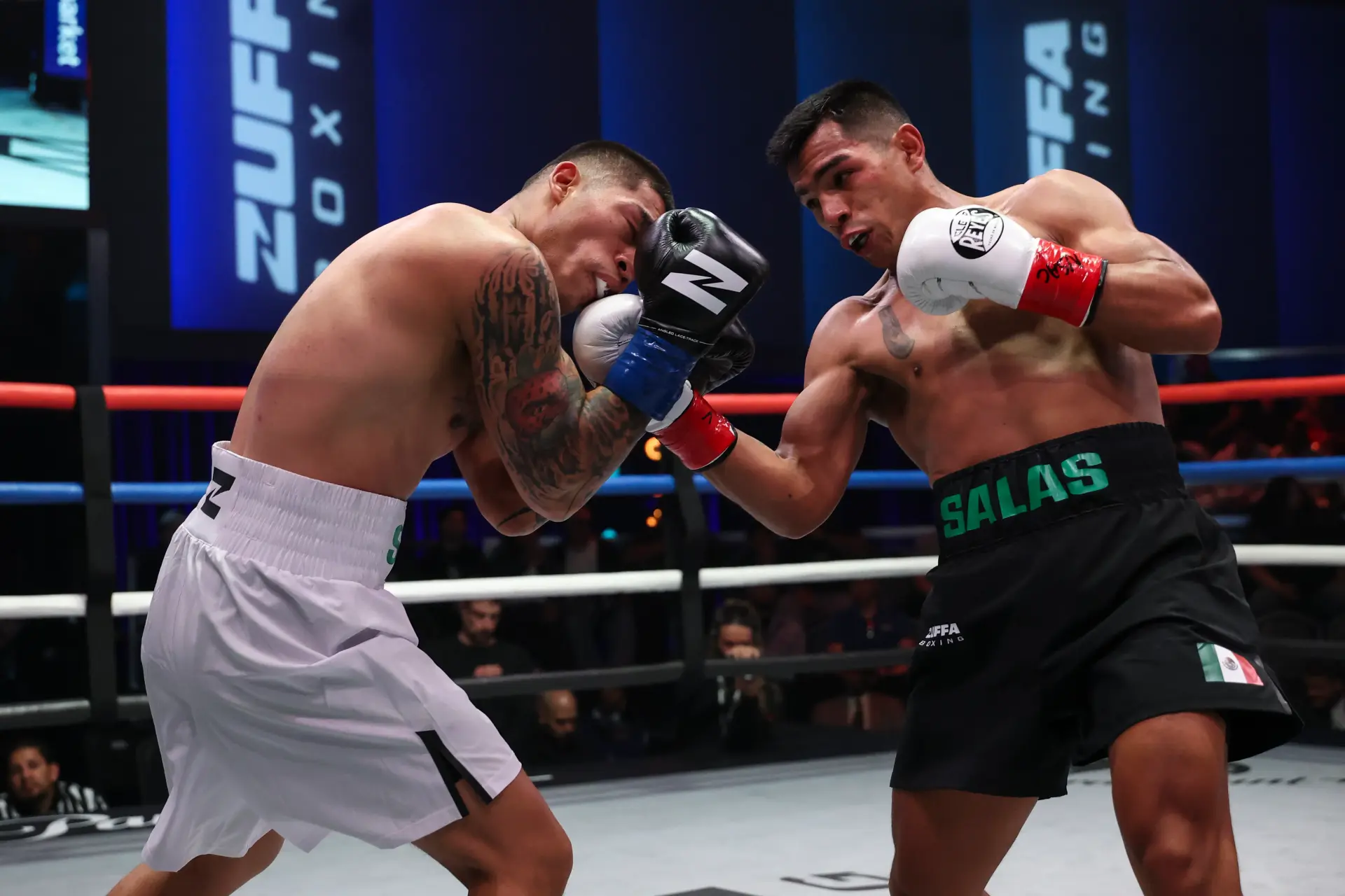 Ricardo Salas lands an uppercut on Jesus Saracho.