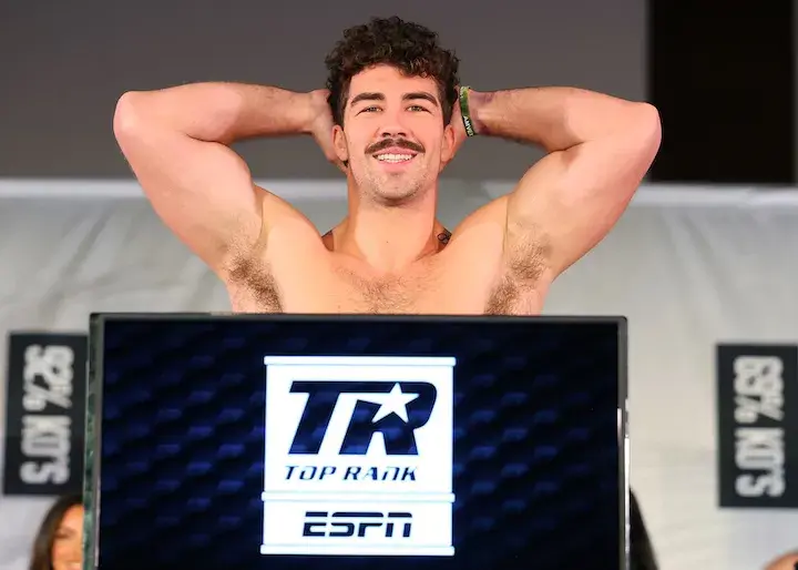 Richard Torrez poses after weighing in for a boxing match.