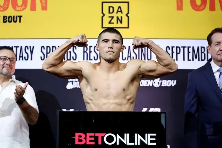 Ruslan Abdullaev flexes after weighing in on September 19, 2025, for his fight with Kevin Johnson.