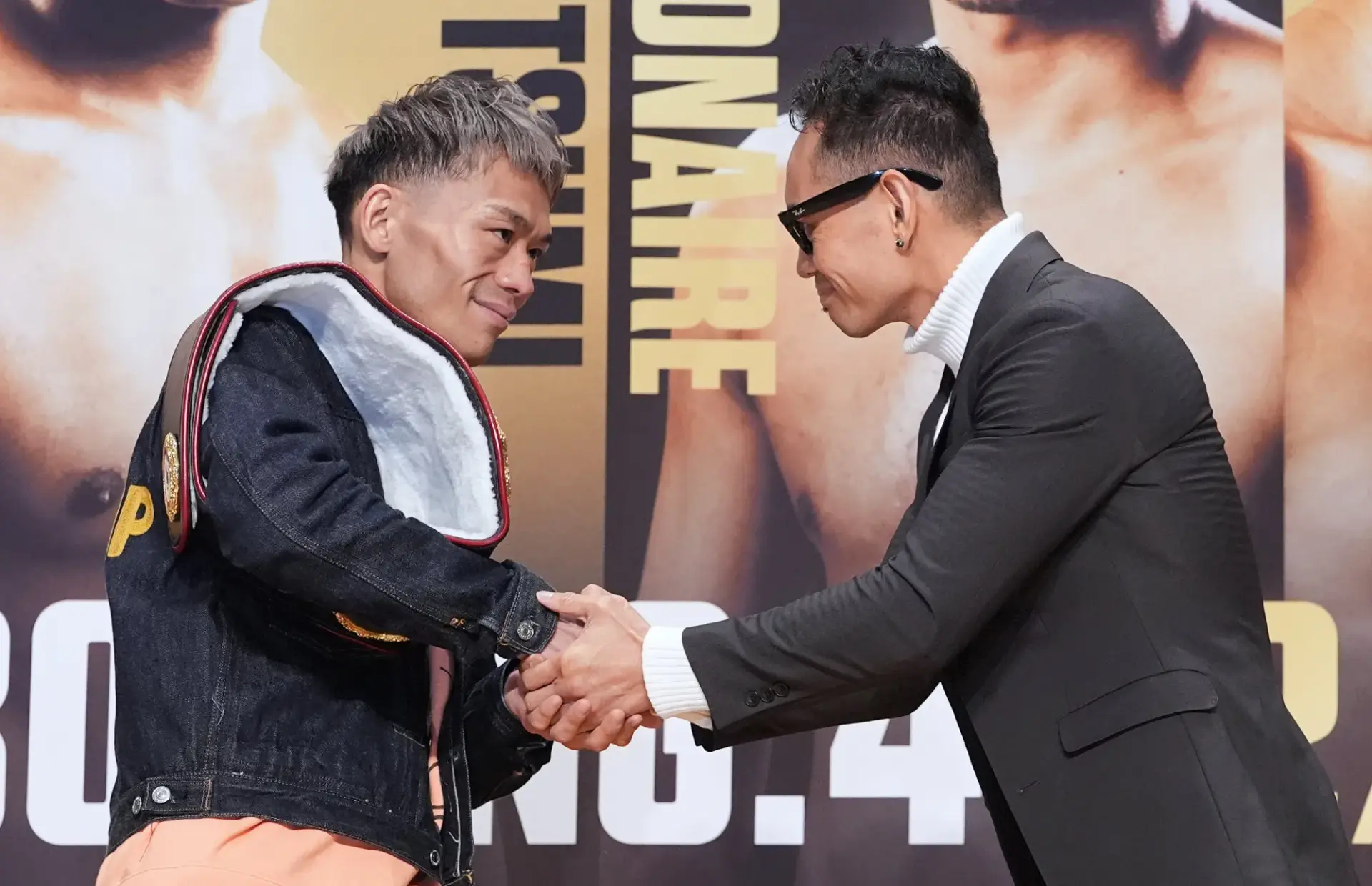 Seiya Tsutsumi and NonitoDonaire shake hands during press conference face-off
