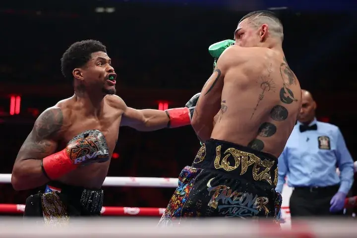 Shakur Stevenson (left) lands a punch on Teofimo Lopez during their fight on January 31, 2026.