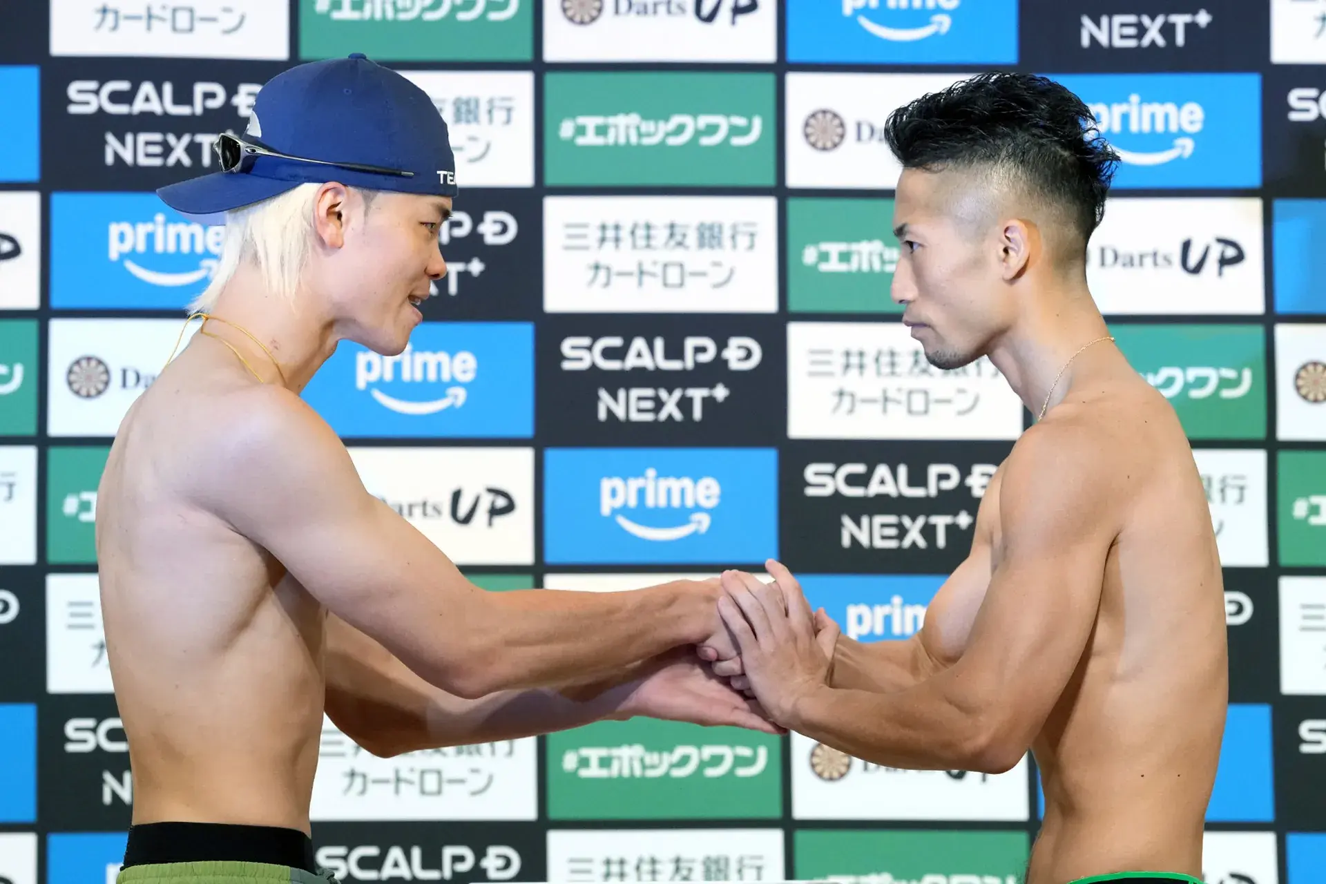 Tenshin Nasukawa and Takuma Inoue shake hands at November 23 weigh-in ahead of WBC title fight