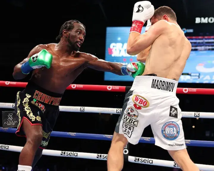 Terence Crawford lands a left hand to the body of Israil Madrimov in their 2024 fight.