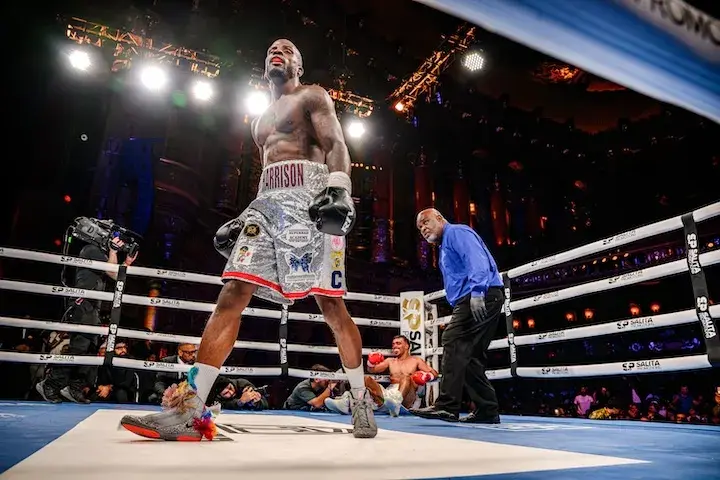 Tony Harrison walks away after dropping Brian Chaves in their boxing match on December 20, 2025.