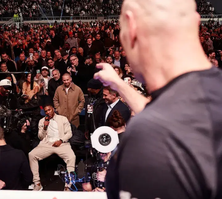 Tyson Fury points at Anthony Joshua in the crowd after defeating Arslanbek Makhmudov in Tottenham, England. (April 11, 2026)