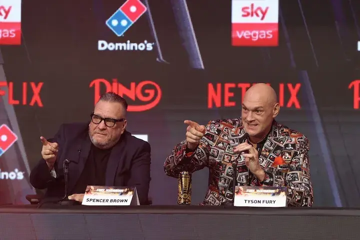 Tyson Fury (right) and Spencer Brown (left) point to the crowd during the final press conference for Fury's fight against Arslanbek Makhmudov. (April 9, 2026)