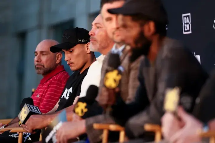 Vergil Ortiz (second from left) sits with manager Rick Mirigian (first from left) and promoter Oscar De La Hoya of Golden Boy Promotions (center) during a press conference on October 6, 2025.