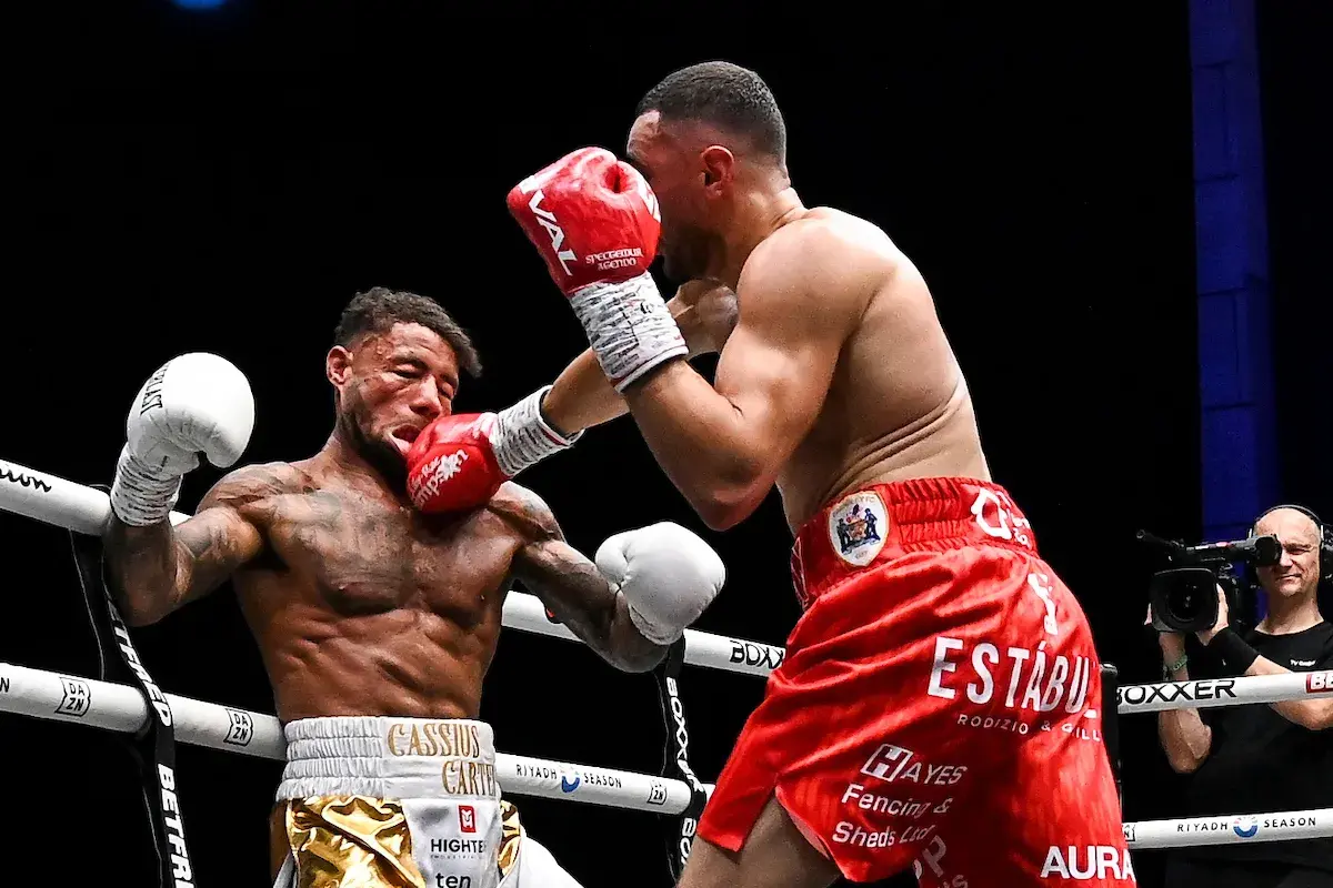 Callum Simpson distorts the face of Troy Williamson with a right hand in their August 2026 rematch