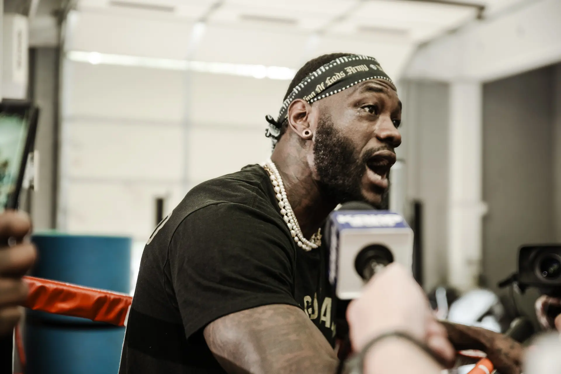 Deontay Wilder is interviewed in the ring at a media workout ahead of his fight with Tyrell Herndon in June 2025.