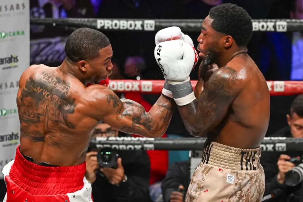 Yan Marcos (left) lands a shot on Dwyke Flemmings Jnr in their bout on April 11, 2026.