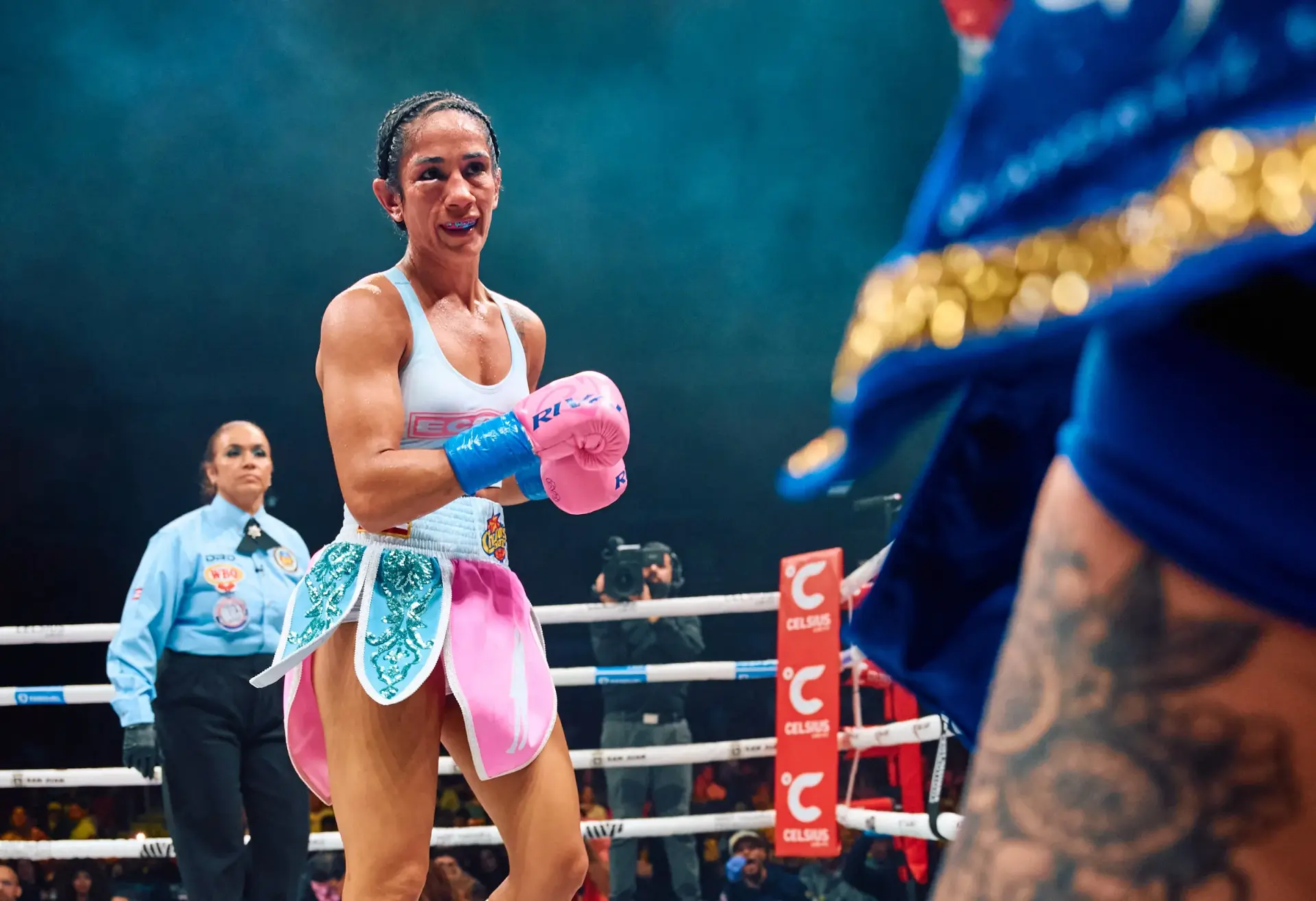Amanda Serrano looks at Reina Tellez through a swollen right eye during their boxing match on January 3, 2026.