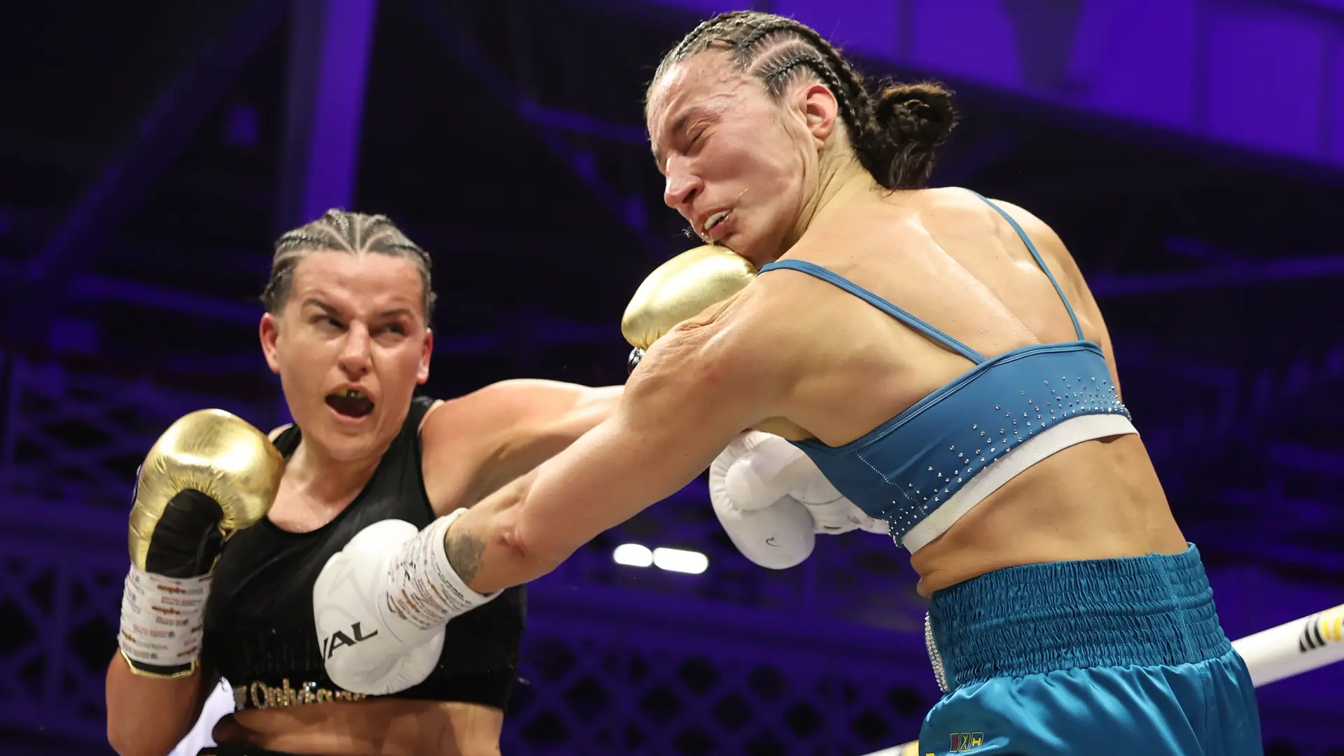 Chantelle Cameron lands a jab on Michaela Kotaskova.