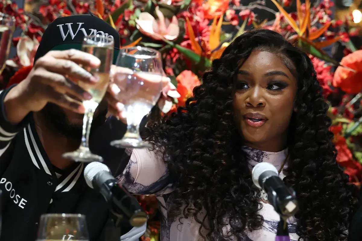 Claressa Shields toasts at her press conference.