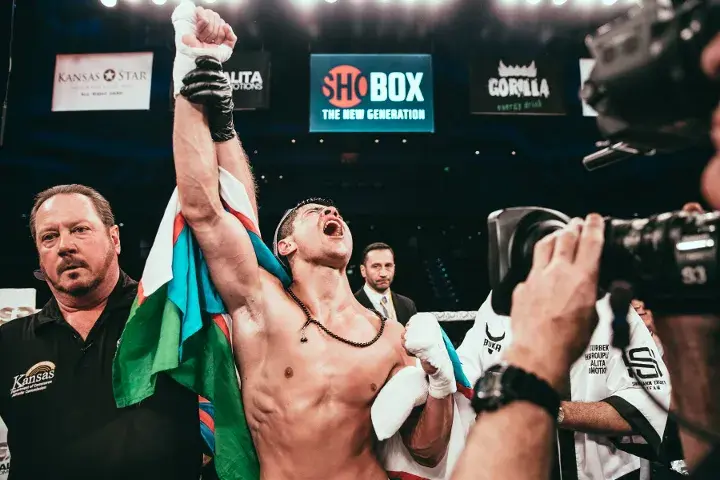 Shohjahon Ergashev celebrates after outpointing Mykal Fox in 2019