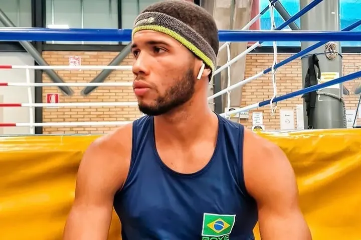 Hebert Conceicao Sousa is seated outside of a boxing ring.