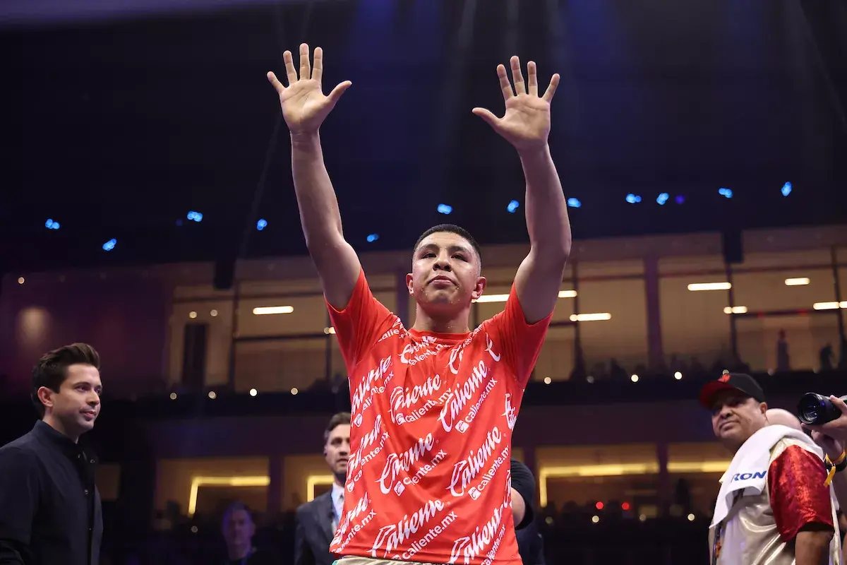 Jaime Munguia raises his arms and hands in the air following his rematch victory over Bruno Surace on May 3, 2025.