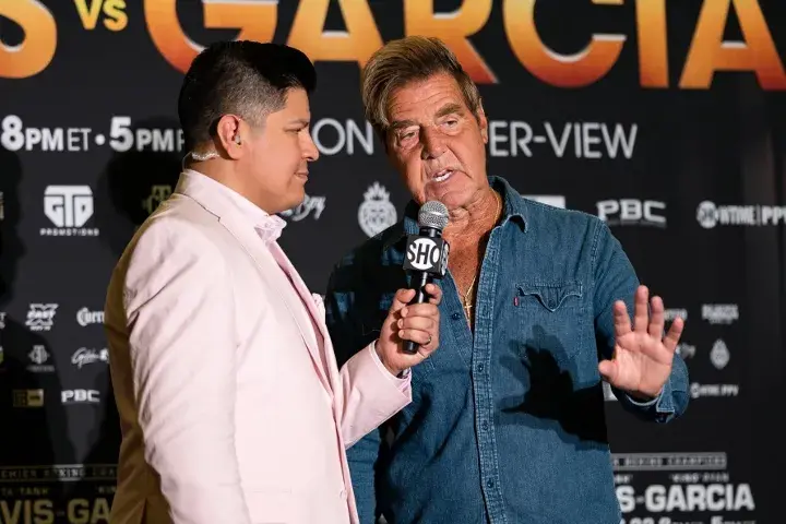 Boxing trainer Joe Goossen conducts an interview