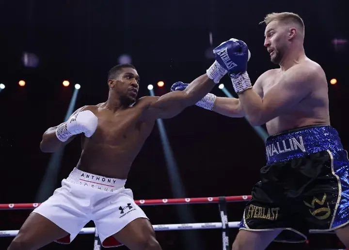 Anthony Joshua sends a jab at Otto Wallin in their boxing match in December 2023.