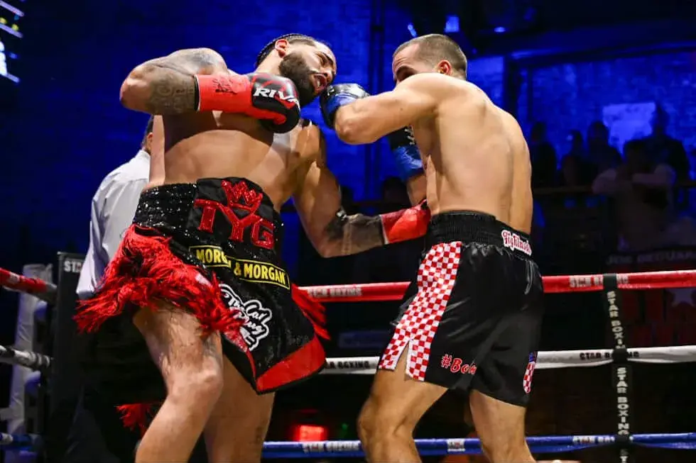 Junior Younan (L) lands a left uppercut to the midsection of Luka Lozo