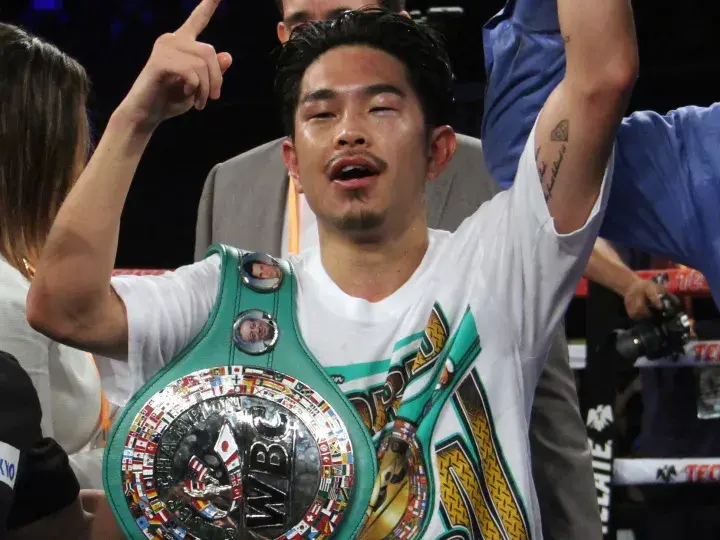 Kazuto Ioka is pictured with a WBC world title belt.