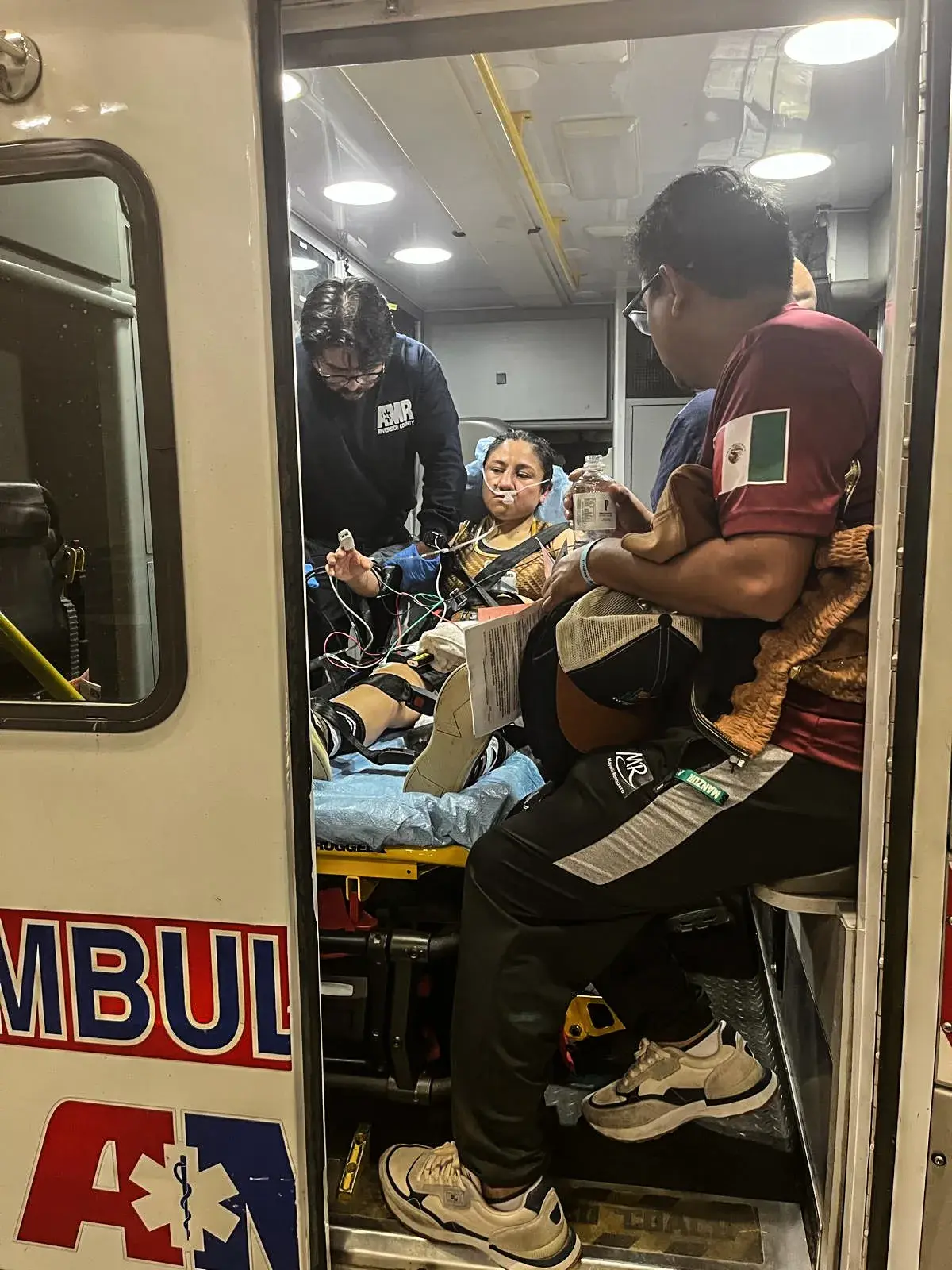 Mayelli Flores being taken to the hospital after fight