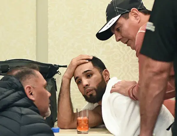 Luis Nery rehydrates after a weigh-in