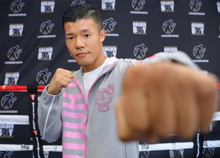 Tomoki Kameda poses for cameras at a media workout