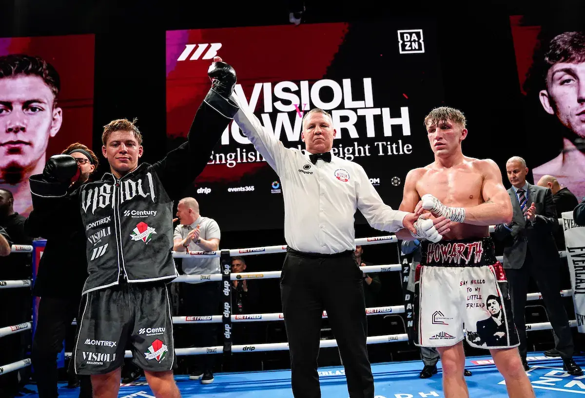 Giorgio Visioli has his hand raised in the air by the referee after outpointing Joe Howarth on December 17, 2025.