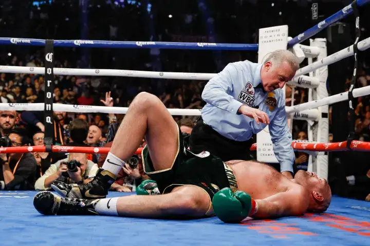 Jack Reiss counts over Tyson Fury after he was knocked down in the dramatic 12th round of his first fight with Deontay Wilder.