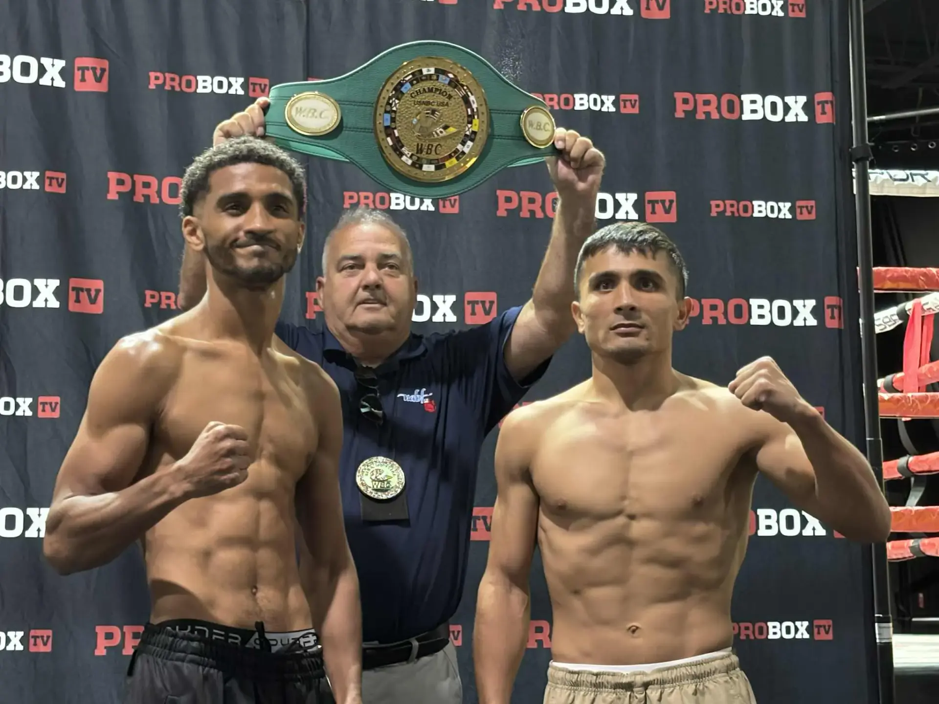 William Foster and Muhammadkhuja Yaqubov on the scales